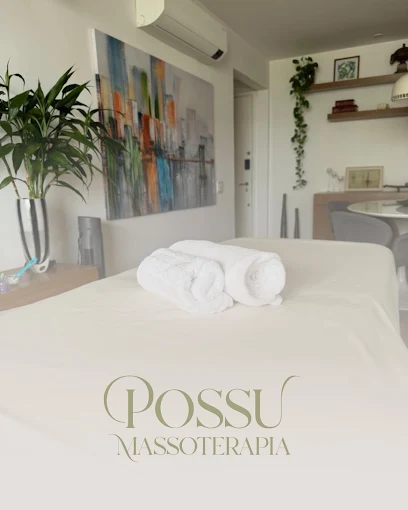 Table made up in a bright room, with rolled towels on top